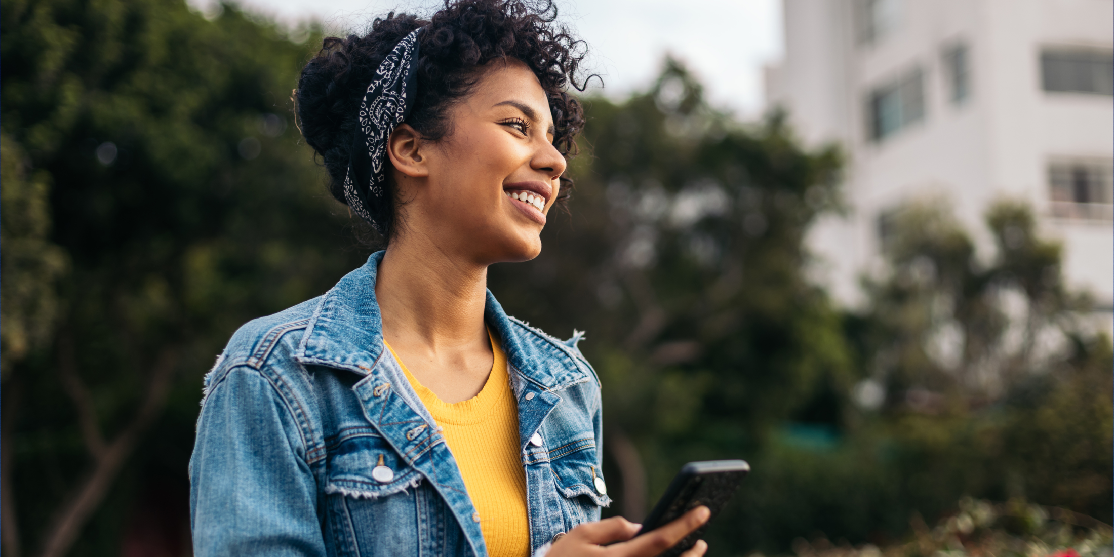 Woman holding a phone. 