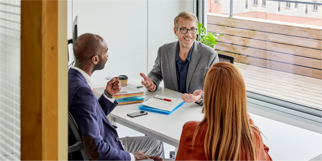 A couple meets with a financial advisor. 